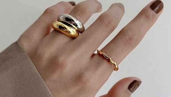 Wearing-a-chunky-gold-ring-and-gold-wave-ring-together-with-a-chunky-silver-ring