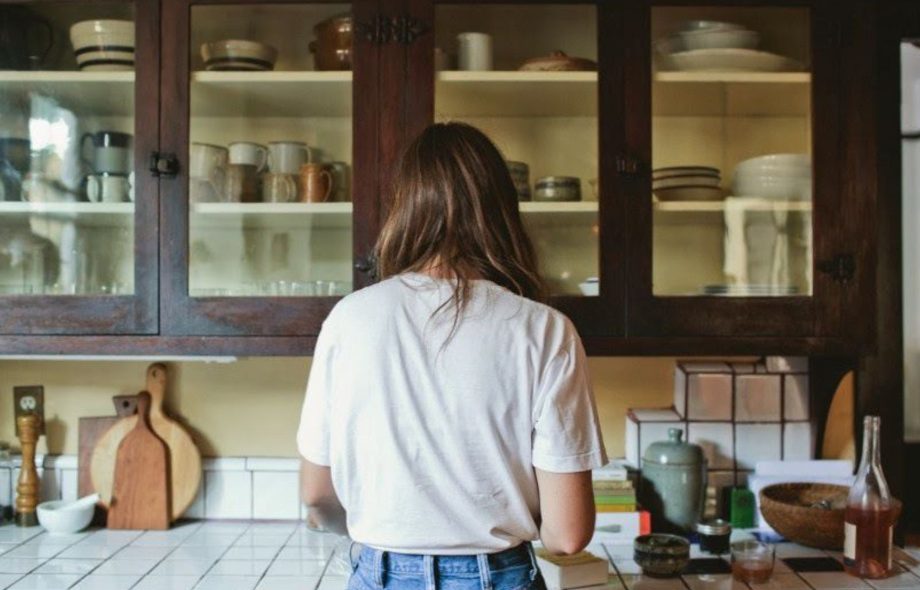 A beautiful girl maintaining the kitchen equipment