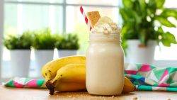 A mug of banana healthy milkshake showcasing why it should be mandatory in your daily diet plan