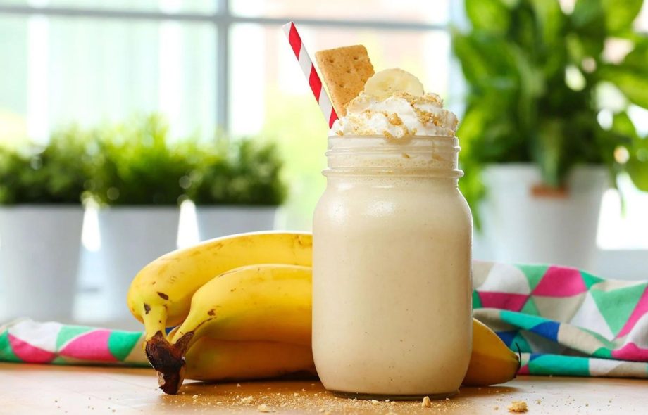 A mug of banana healthy milkshake showcasing why it should be mandatory in your daily diet plan