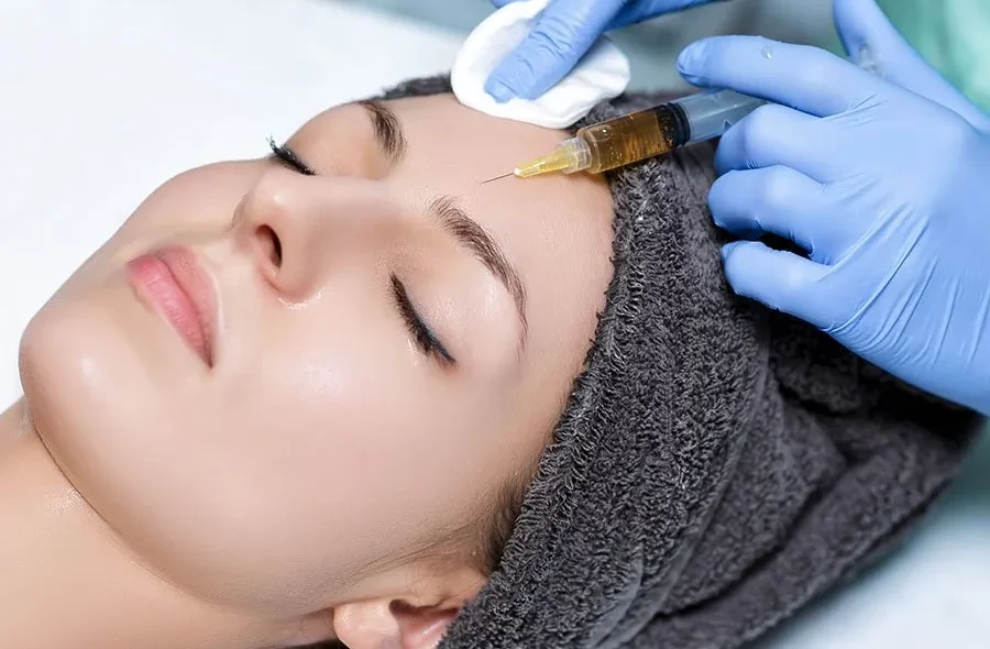 A beautiful women getting face prp therapy