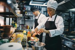 Crew working at culinary workstation