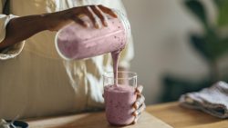 Woman making milkshake