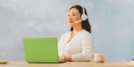 heroimageofcallcentercustomerservicerepresentativesitsinfrontofalaptop