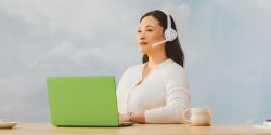 heroimageofcallcentercustomerservicerepresentativesitsinfrontofalaptop