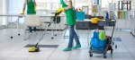 A professional cleaner ensuring every corner is spotless during a home cleaning service.